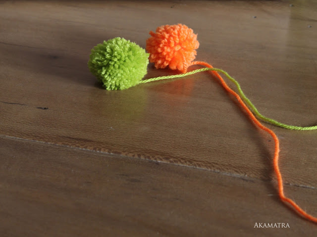 Make a pom pom toy for your cat