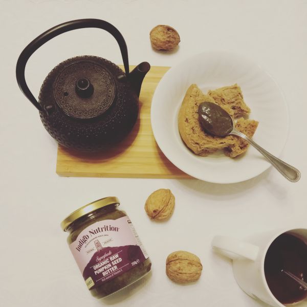 flatlay with tea and pumpkin seed butter